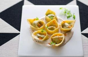 Kale and Chickpeas Ravioli with Orange Flavored Hazelnut Sauce